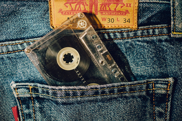 clear and black cassette tape in pockey, jeans, denim, textile