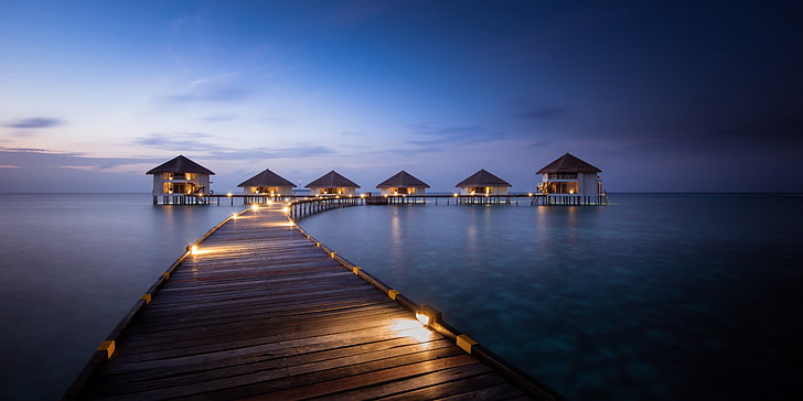 brown wooden dock and cottages, Maldives, resort, artificial lights