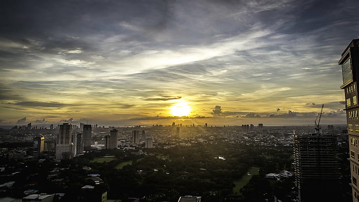 Aerial photography of city near body of water during golden hour, manila, manila