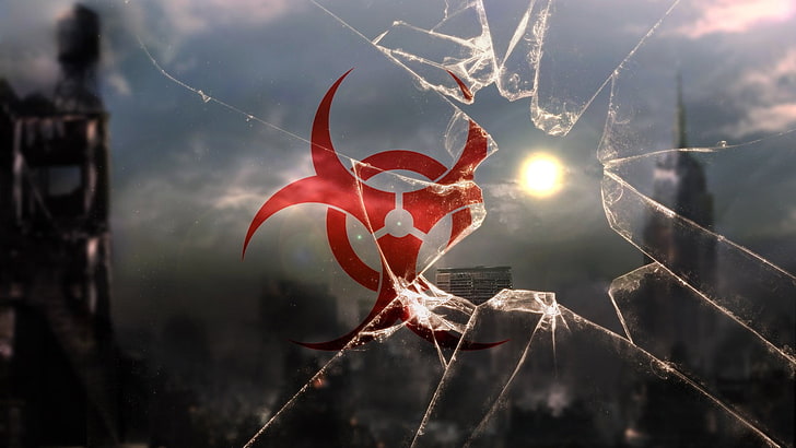 broken glass with red logo, nuclear, apocalyptic, close-up, focus on foreground