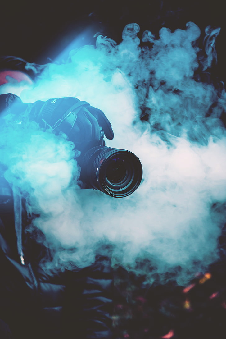 black DSLR camera, photographer, smoke, color smoke, smoke - physical structure
