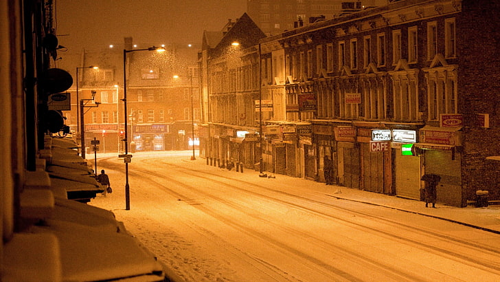 architectural photo of buildings, street, snow, city, illuminated