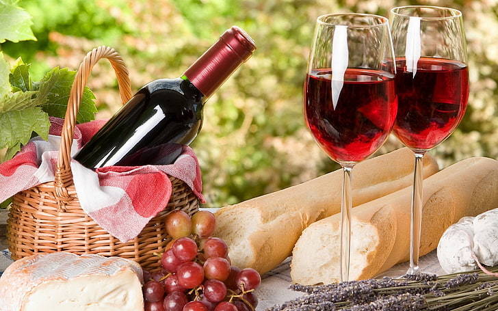 champagne glasses and basket, wine, cheese, bread, grapes, picnic