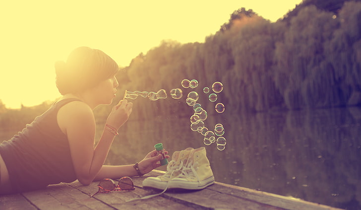 women, bubbles, sitting, real people, one person, leisure activity