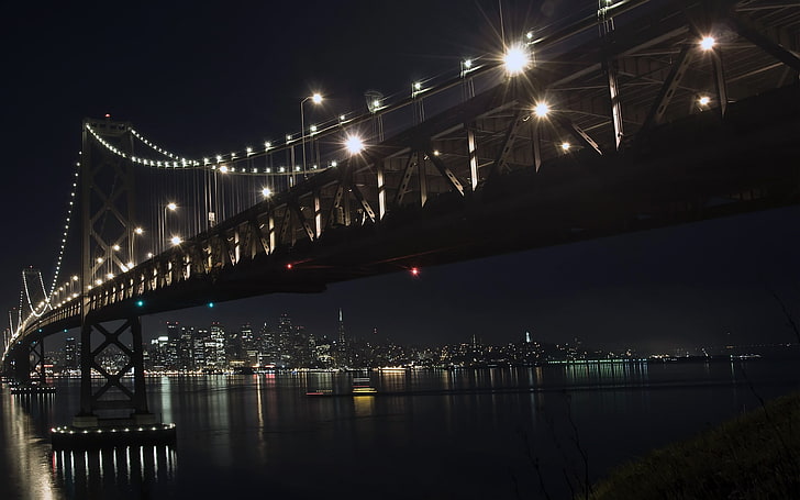 black lighted bridge over body of water, cityscape, night, lights