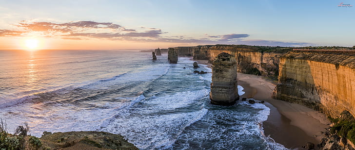 in distance photo of rock monolith and body of water, The Twelve Apostles