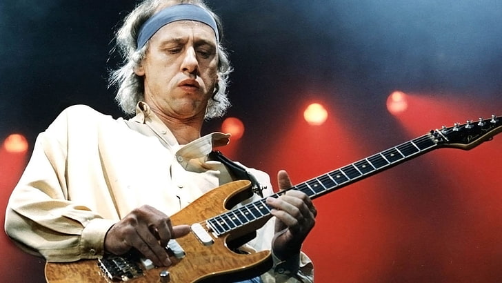 men's white dress shirt and brown electric guitar, dire straits