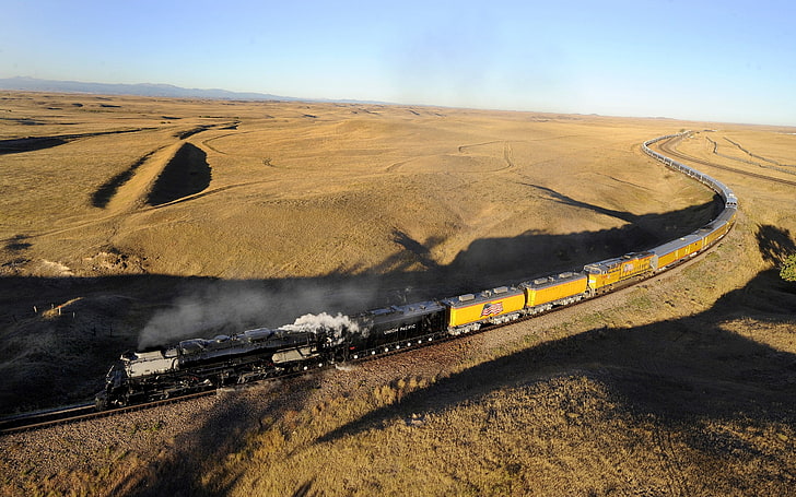 yellow and black train on desert, steam locomotive, diesel locomotive