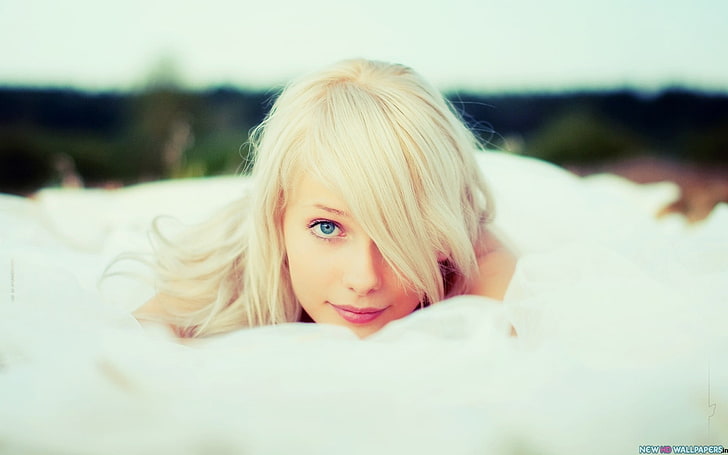 woman lying on white textile, women, blonde, blue eyes, face