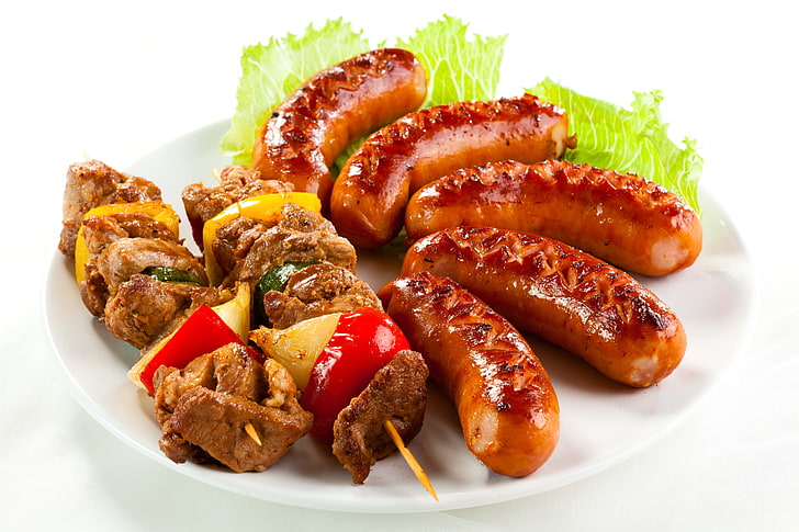 cooked meat and sausages, kebabs, herbs, plate, white background