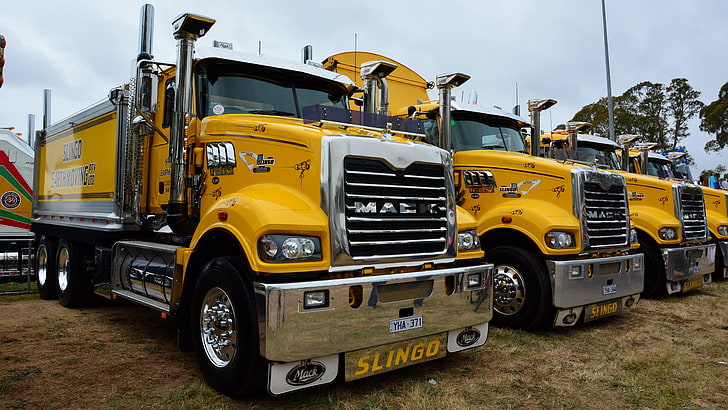 HD wallpaper: mack trucks, mode of transportation, yellow, land vehicle,  sky | Wallpaper Flare