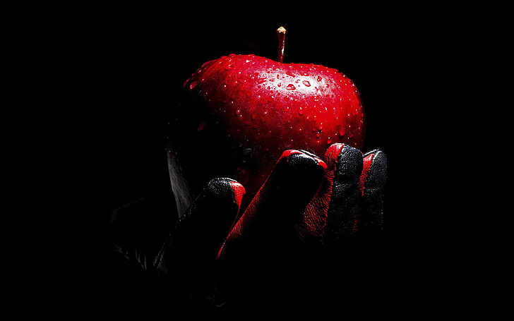 HD wallpaper: person holding red apple digital wallpaper, drops, glove, black  background | Wallpaper Flare