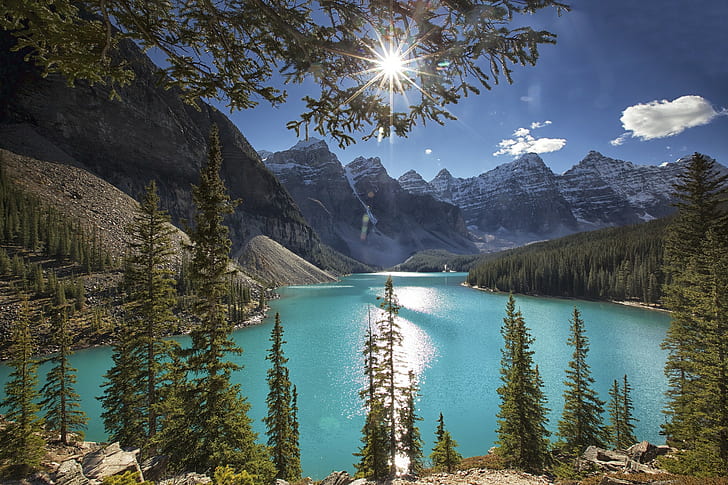 HD wallpaper: Moraine Lake, Alberta, Canada, sun, rocks, sky, clouds, forest