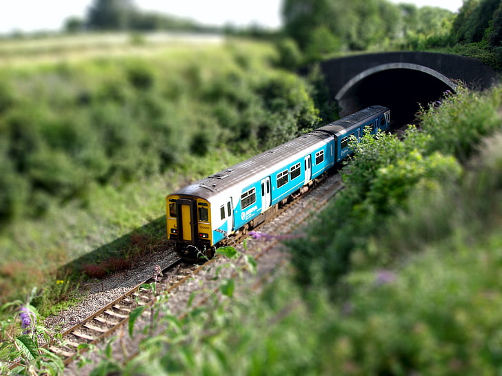 teal and white steam train, nature, blurred, tilt shift, toys