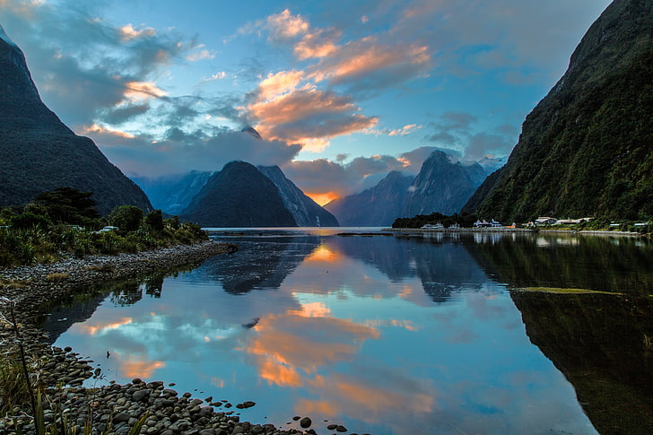 mountain valley and body of water, milford sound, new zealand