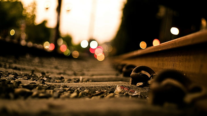 close up photography of a railway, illuminated, city, selective focus