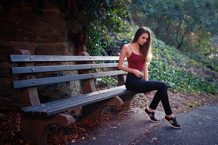 women's red camisole, model, women outdoors, sitting, bench, lifestyles