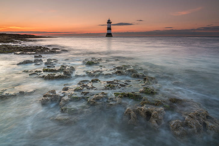 Lighthouse on body of water surrounded stones, penmon, penmon, HD wallpaper
