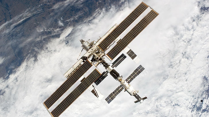 silver-colored cross pendant necklace, International Space Station