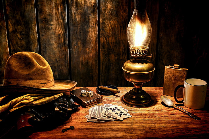 brown cowboy hat, surface, style, table, cubes, lamp, key, bones