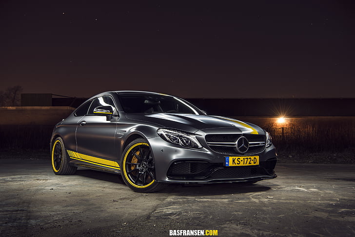 silver and yellow Mercedes-Benz coupe parked on concrete ground