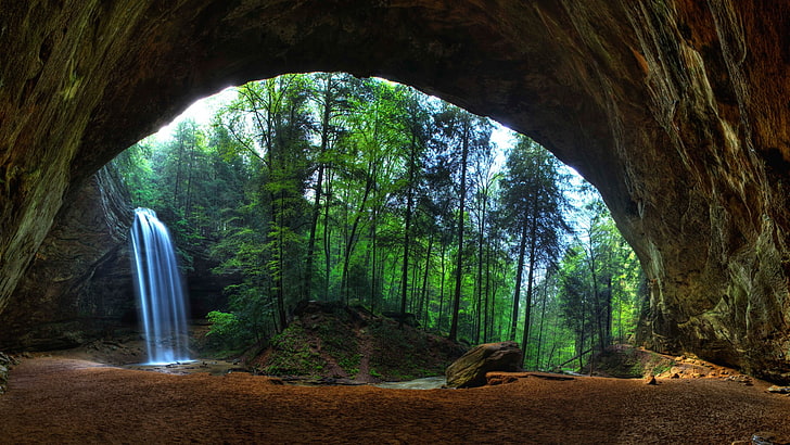 waterfalls near trees and cave during day, nature, landscape