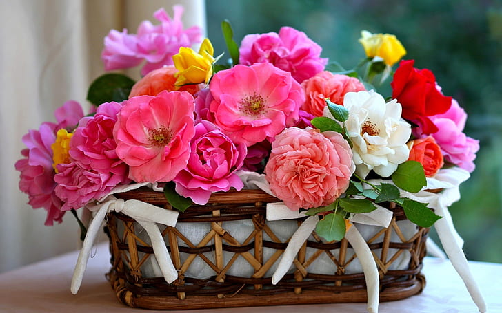 A basket of roses, brown and pink white large flower arrangement