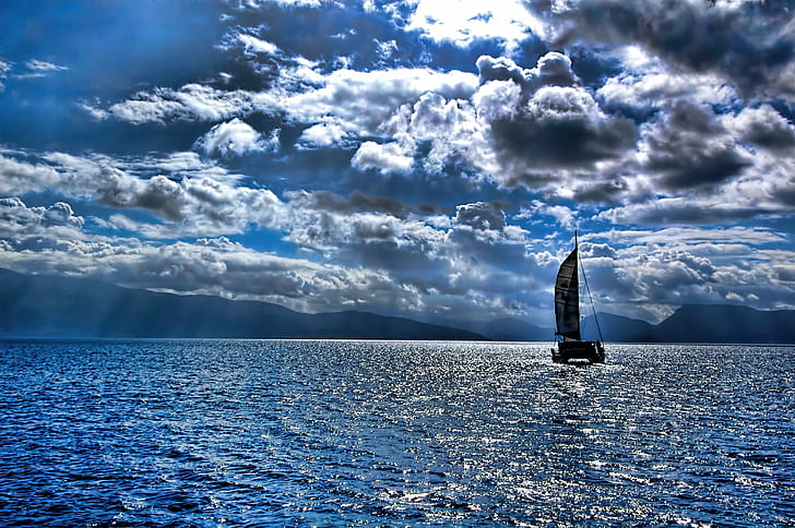 black sailing boat under cumulus clouds on body of water, Relocation