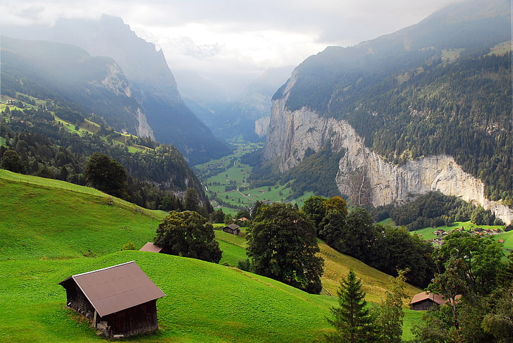 green trees, brown wooden house, and mountains, rocks, Switzerland