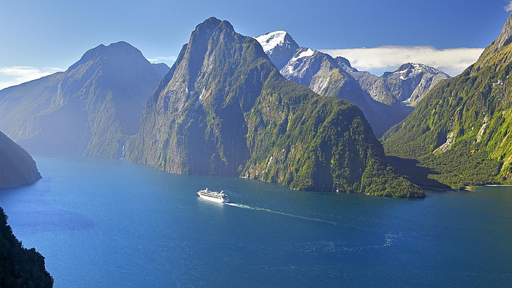 A cruise ship making its way through Milford Sound, Fiordland National Park, New Zealand.