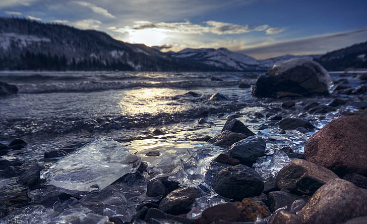 photography of gray stone near body of water, cold as ice, price