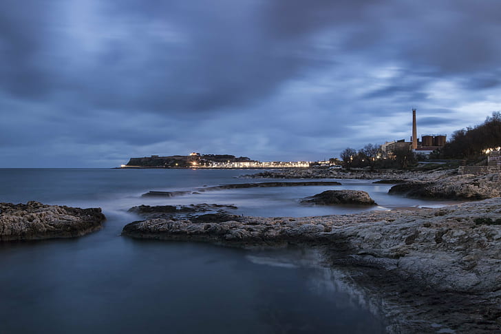 lighted buildings near calm body of water under grey clouds, Rethymno, HD wallpaper