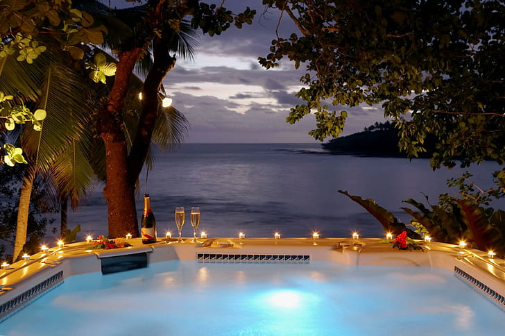 Sunset Jacuzzi Fiji, two clear glass champagne flute, candles