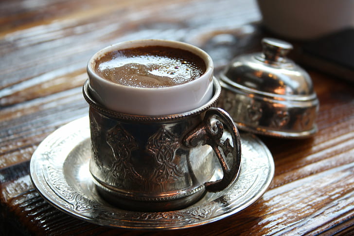 stainless steel teacup filled with coffee placed on top of table, turkish, turkish