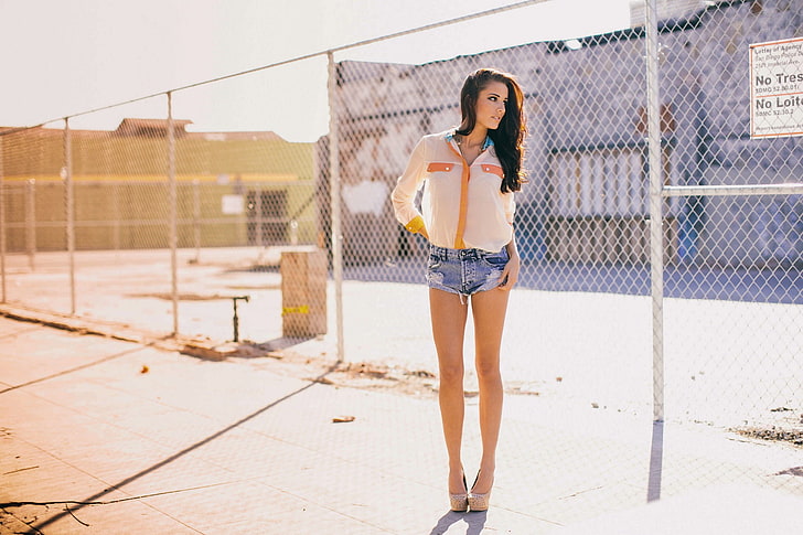 women's white and orange western shirt and blue denim short shorts outfit