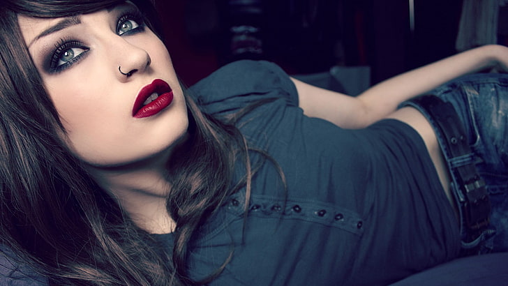 woman in black shirt lying, lying down, blue eyes, brunette, red lipstick