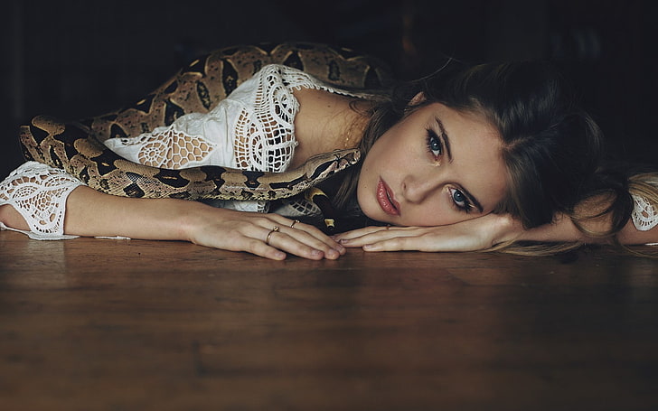 women, blue eyes, snake, looking at viewer, lying on front