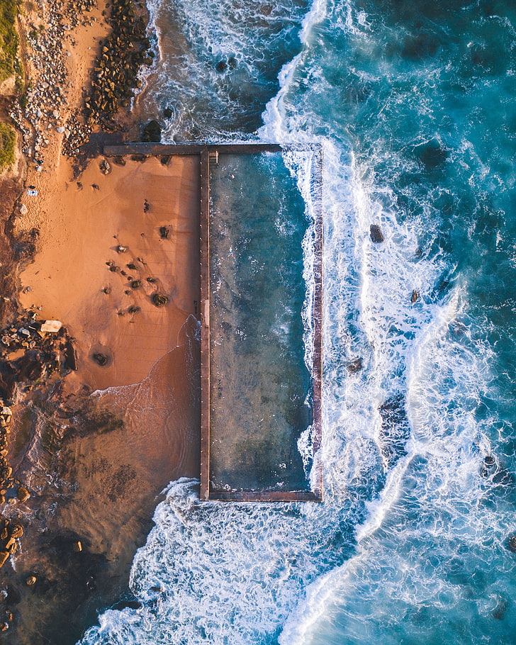 body of water, nature, rock, aerial view, motion, sea, wave, sport