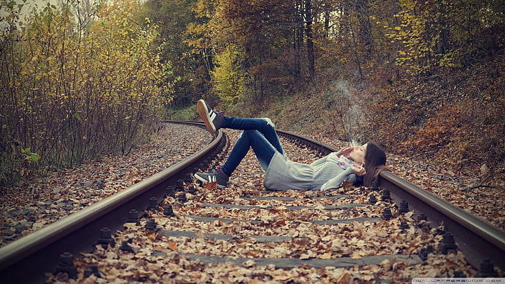 woman in blue jeans lying on train railway, women, women outdoors