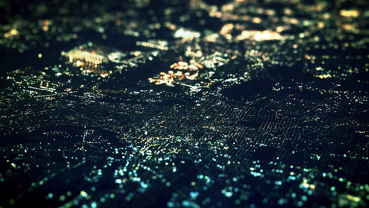 skyline city, low light photo of land, night, tilt shift, aerial view
