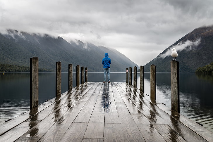 men's blue hoodie, pier, man, mountains, alone, solitude, lake, HD wallpaper