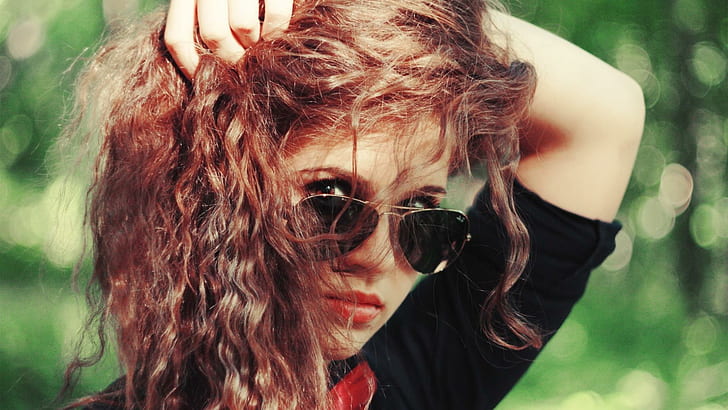 Redhead playing with her hair, women's brass framed aviator ray-ban sunglasses