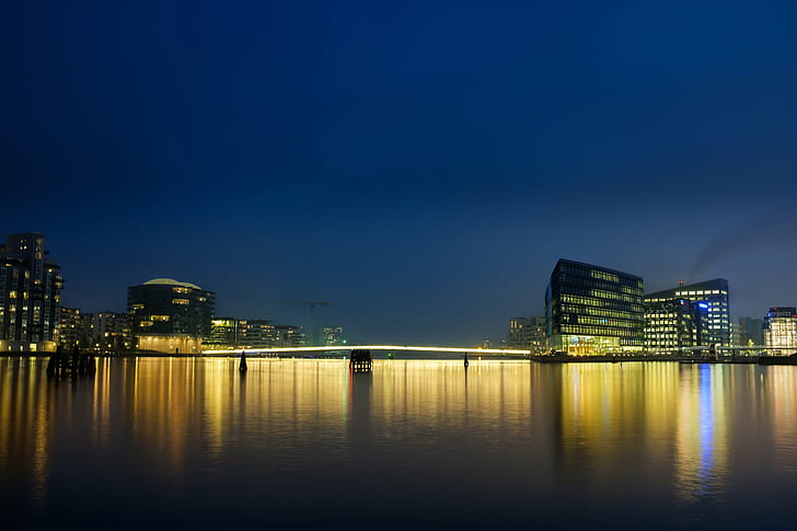 city buildings and body of water during night time, copenhagen, copenhagen