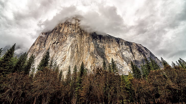USA, California, Yosemite National Park, rock mountain, trees, clouds, white and black mountain near clouds