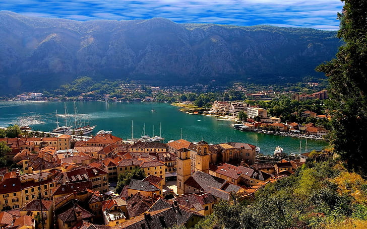 Perfect town, houses beside body of water and mountains, world