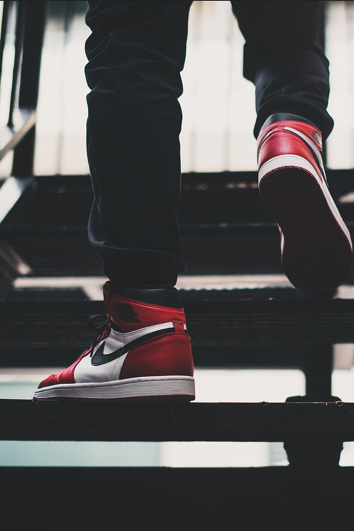 pair of red-and-white Nike Air Jordan 1's, shoes, stairs, human body part