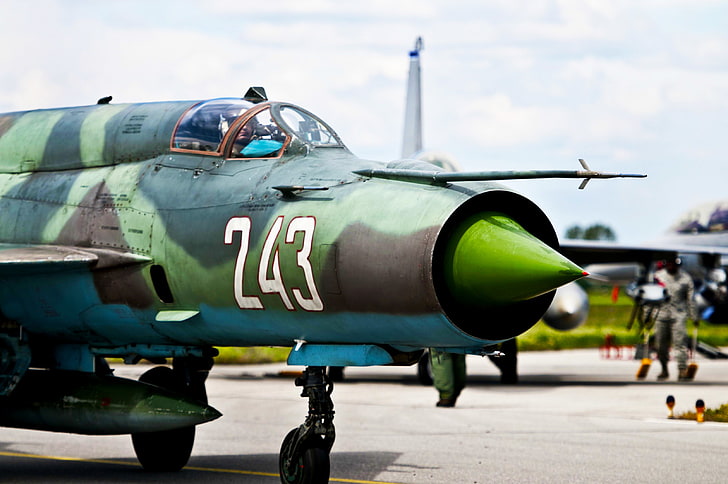 black and green camouflage fighting jet plane, mig-21, fishbed