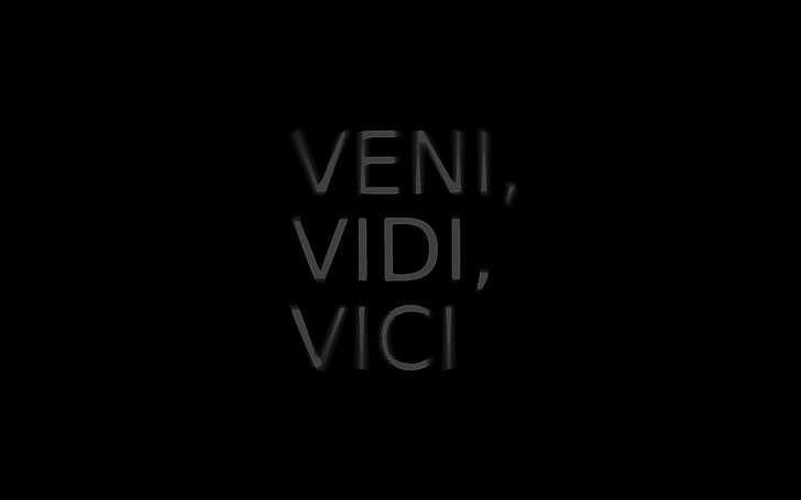 black background with veni, vidi text overlay, letters, labels