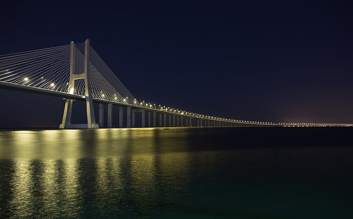 Vasco Da Gama Bridge at Night, brown suspension bridger, City