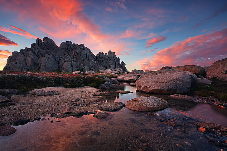 landscape photo of gray stone on body of water in sunset, Tors